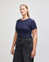 A navy blue crop fitted t-shirt for women, paired with high-waisted jeans, featuring a branding logo.