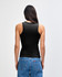 A fitted black tank top is displayed on a model, paired with blue jeans, showcasing a simple and stylish design.