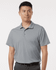 A grey men's polo shirt with a collar and short sleeves, featuring a logo on the chest area.