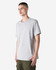 A heavyweight cotton unisex T-shirt in light grey, featuring a relaxed fit and short sleeves. It has a logo.