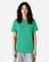 A green heavyweight cotton unisex T-shirt displayed on a model with curly hair, set against a plain background.
