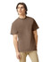 A brown heavyweight adult t-shirt displayed on a model, featuring short sleeves and a simple design.