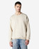 A beige Gildan Heavy Blend adult crewneck sweatshirt displayed on a model, featuring a relaxed fit and long sleeves.