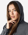 A dark grey hooded sweatshirt is displayed, featuring a model with long hair and a subtle smile.