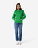 A green hooded sweatshirt with a front pocket and drawstring, worn with blue jeans and white sneakers.