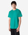 A man wearing a solid turquoise Gildan Ultra Cotton adult T-shirt, with a plain design and a visible logo.