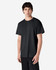 A black Gildan Ultra Cotton adult T-shirt on a model, featuring a simple design and standard fit.