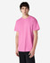A pink Gildan Ultra Cotton adult t-shirt displayed on a model, featuring short sleeves and a basic cut.