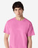 A pink Gildan Ultra Cotton adult T-shirt displayed by a model, featuring a plain design and a logo.