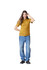 A model wearing a mustard yellow unisex short sleeve t-shirt paired with light blue baggy jeans and black shoes.