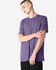 A unisex short sleeve t-shirt in a purple hue, featuring a simple design and a logo.