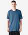 A unisex short sleeve t-shirt in a blue shade, displayed on a model with straight posture. Features a logo.