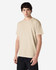 A light beige Gildan Heavy Cotton adult T-shirt worn by a male model, featuring a plain design and a logo.