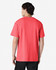 A pink Gildan Heavy Cotton Adult T-Shirt, displayed from the back, featuring a plain design.