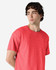 A red Gildan Heavy Cotton Adult T-Shirt on a model, featuring a simple design and a crew neck.