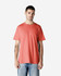 A side view of a man wearing a coral Gildan Heavy Cotton adult t-shirt with short sleeves.
