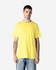 A yellow Gildan Heavy Cotton Adult T-Shirt is worn by a man standing against a plain background.
