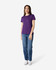 A purple Gildan Heavy Cotton Ladies' T-Shirt displayed on a model paired with blue jeans and white sneakers.