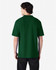 A green Gildan Softstyle adult double pique polo shirt is displayed from the back, featuring short sleeves.