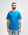 A model wearing a bright blue Gildan Softstyle adult midweight t-shirt, featuring a simple design and a logo.