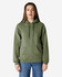 A woman wearing a green hooded sweatshirt with a front pocket and drawstring, standing against a plain background.