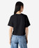 A black women's boxy T-shirt made from fine jersey fabric, featuring a simple back design and short sleeves.