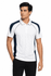 A white polo shirt with navy side panels, featuring a collar and a logo.