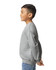 A grey youth sweatshirt is displayed, featuring long sleeves and a ribbed neckline. The model is positioned sideways.