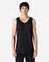 A black Gildan Heavy Cotton adult tank top on a model, featuring a plain design and a logo on the label.