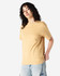 A unisex heavyweight cotton t-shirt in a mustard yellow shade, featuring a relaxed fit and short sleeves.