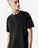 A unisex heavyweight cotton t-shirt in black, featuring a relaxed fit and a brand logo.