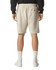 Beige unisex pique gym shorts featuring an elastic waistband and a single back pocket.