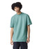 A teal unisex pique mockneck t-shirt with short sleeves, featuring a logo on the front.