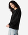 A black unisex crewneck sweatshirt with a relaxed fit and ribbed cuffs. It features a branding logo.