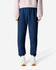 Unisex sweatpants in navy blue, featuring an elastic waistband and cuffs, paired with a light pink top and white shoes.