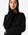A black women's crewneck sweatshirt with long sleeves, featuring a simple design and a branded logo.