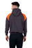 A dark grey hoodie with orange contrast panels on the shoulders, featuring a hood and a logo.