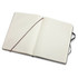 An extra large, black Moleskine classic hard cover notebook with blank lined pages, featuring an elastic band and ribbon bookmark.