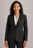 A women's longline jacket in black, featuring a tailored fit, lapel collar, and pockets. The model is smiling.