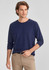 A navy long sleeve tee for men, featuring a relaxed fit and a logo. Paired with light-coloured pants.