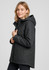 A women's black Melbourne Comfort Jacket with a hood, featuring a zip closure and side pockets. The jacket has a logo.