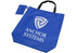 A blue reusable grocery bag with black handles and a small pouch, featuring a logo.