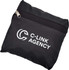 A black travel bag with a zip closure and a logo on the front, compactly folded.