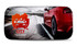 A full colour sunshade featuring a red car on a scenic road with a logo. Dominant colours are red and grey.