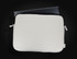 A laptop sleeve in cream and black, featuring a zip closure and a branding logo, designed for a 24cm x 33cm laptop.