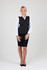 A fitted black soft shell vest with a zippered front, worn over a white shirt and black skirt, featuring a logo.