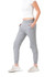 Grey women's track pants with a slim fit and pockets, paired with a fitted white top and shoes.