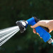 Blue hose nozzle spraying water outside Blue hose nozzle spraying water outside