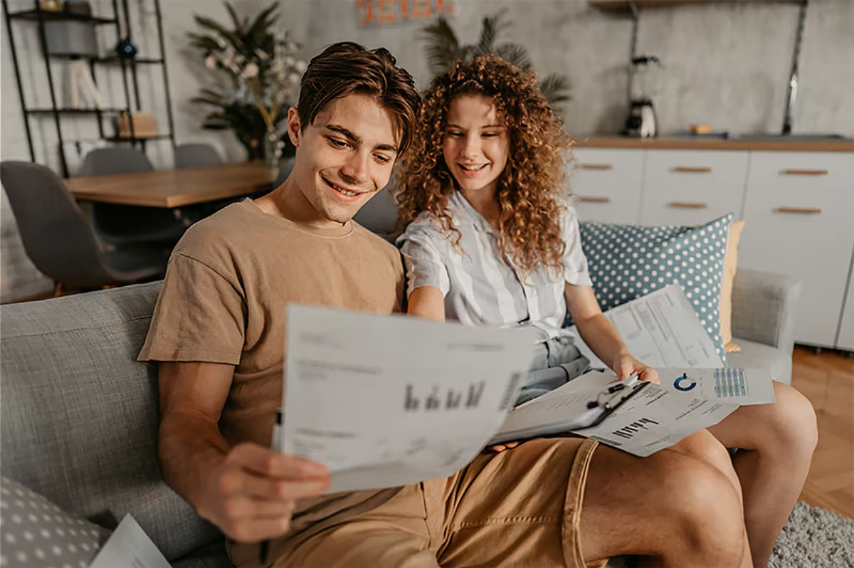 young couple looking at energy savings