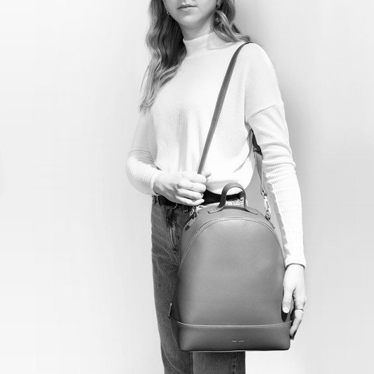 Image of Cora Backpack worn on the side as a crossbody. Image of Cora Backpack worn on the side as a crossbody.